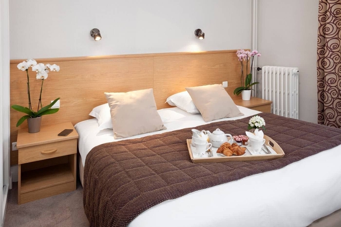 Imagen de la habitación del Hotel The Originals Boutique, Les Nations, Vichy. Foto 9