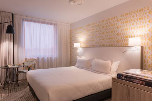 Imagen de la habitación del Hotel The Originals Boutique, Maison Montmartre, Paris Les Puces. Foto 14