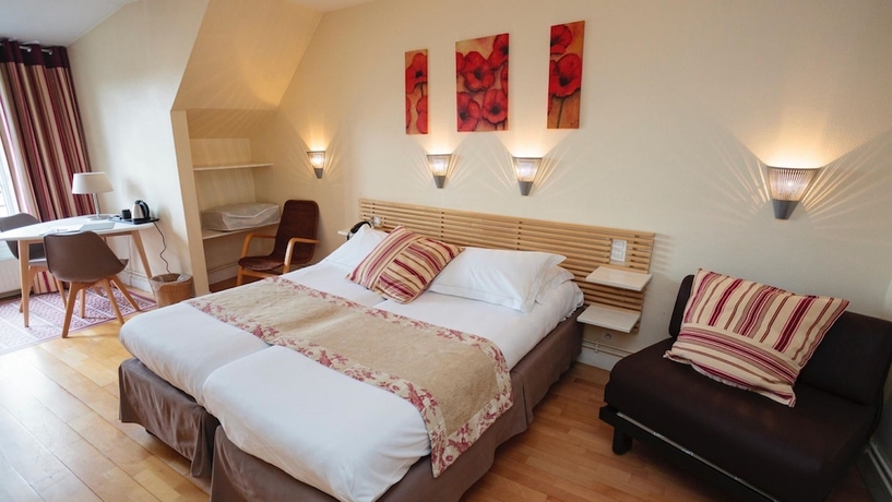 Imagen de la habitación del Hotel The Originals Boutique Victoria Fontainebleau. Foto 7