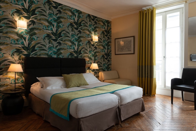 Imagen de la habitación del Hotel The Originals Boutique Victoria Fontainebleau. Foto 18