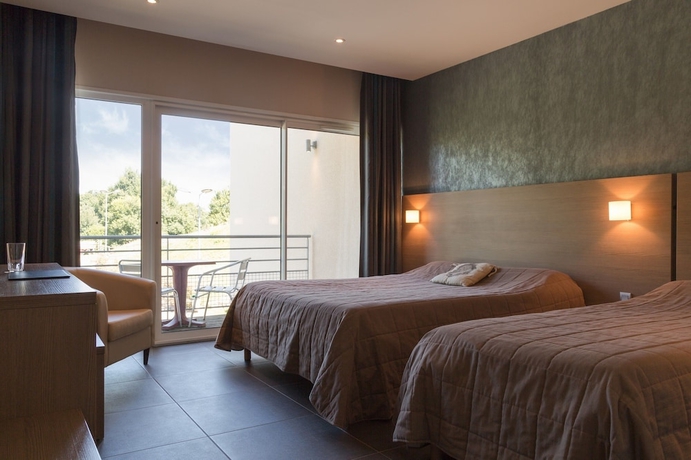Imagen de la habitación del Hotel The Originals City, De France. Foto 16