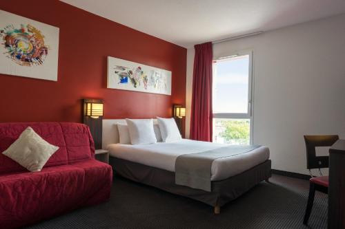 Imagen de la habitación del Hotel The Originals City, Pont Rouge, Carcassonne. Foto 3