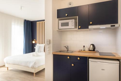 Imagen de la habitación del Hotel The Originals Residence Le Monde Paris Ivry Confluence. Foto 17