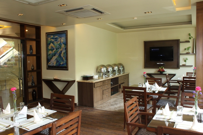 Imagen del bar/restaurante del Hotel The Orion - Greater Kailash. Foto 1