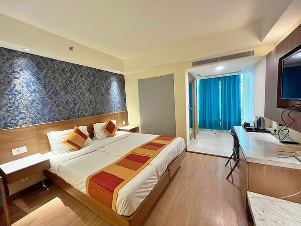 Imagen de la habitación del Hotel The Orion Plaza. Foto 19