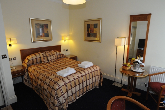 Imagen de la habitación del Hotel The Palace and Spa. Foto 6