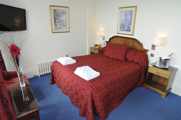 Imagen de la habitación del Hotel The Palace and Spa. Foto 8