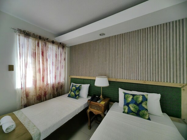 Imagen de la habitación del Hotel The Palacio De Laoag. Foto 17