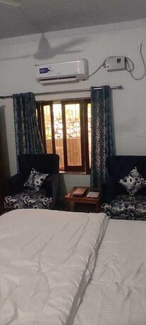 Imagen de la habitación del Hotel The Palm Bliss Resort. Foto 19