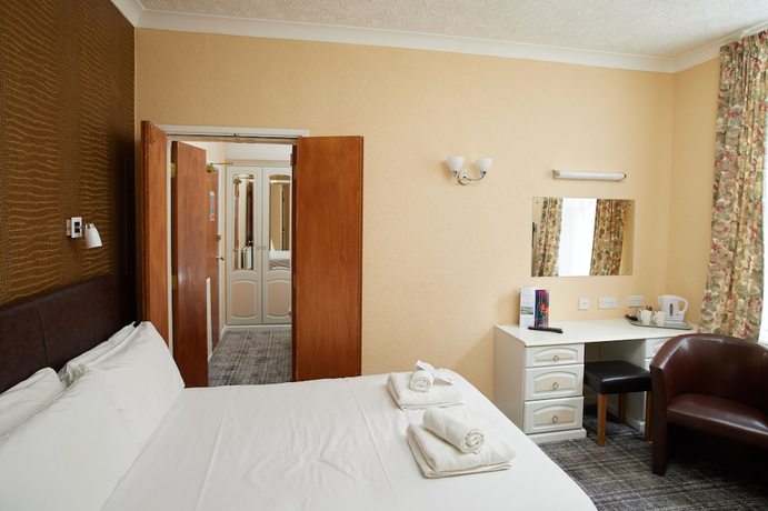 Imagen de la habitación del Hotel The Palm Court. Foto 3