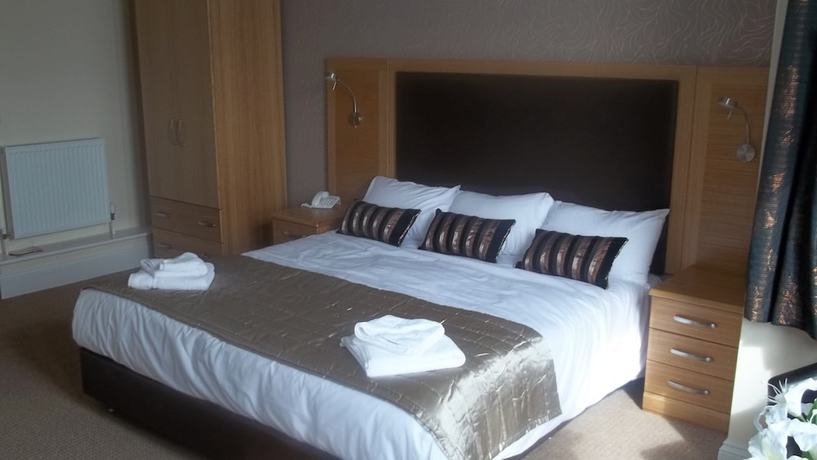 Imagen de la habitación del Hotel The Palm Court. Foto 6