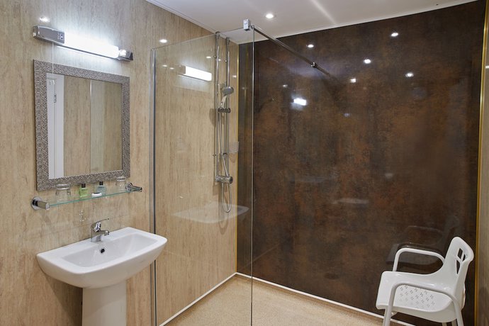 Imagen de la habitación del Hotel The Palm Court. Foto 10