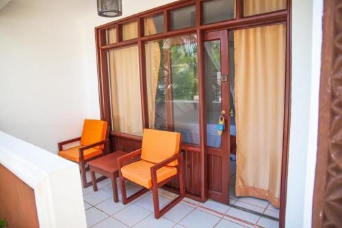 Imagen de la habitación del Hotel The Palm Diani Resort. Foto 19