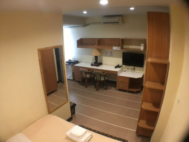 Imagen de la habitación del Hotel The Palm. Foto 13