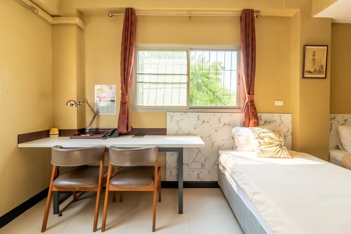 Imagen de la habitación del Hotel The Palm. Foto 17