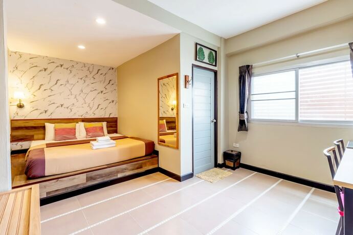 Imagen de la habitación del Hotel The Palm. Foto 19