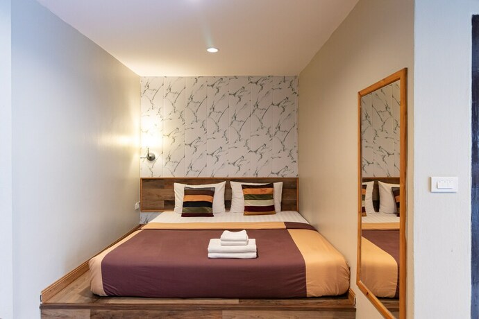 Imagen de la habitación del Hotel The Palm. Foto 23