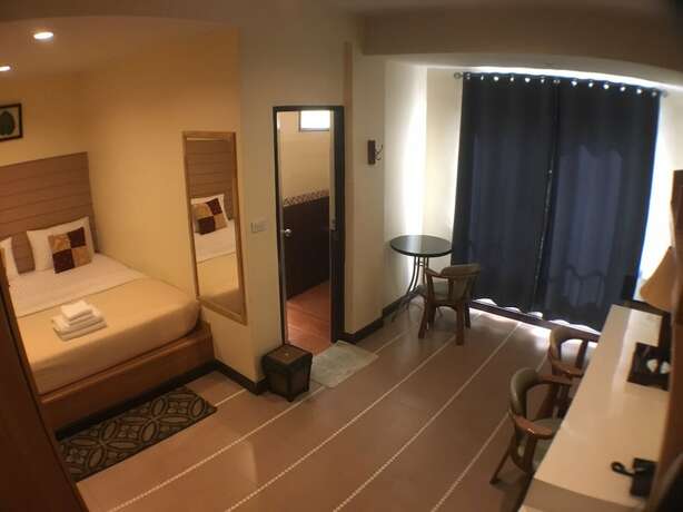 Imagen de la habitación del Hotel The Palm. Foto 24