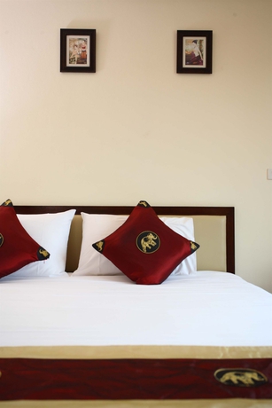 Imagen de la habitación del Hotel The Palm Garden. Foto 3