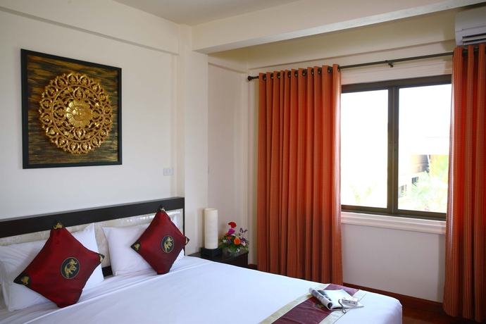 Imagen de la habitación del Hotel The Palm Garden. Foto 5