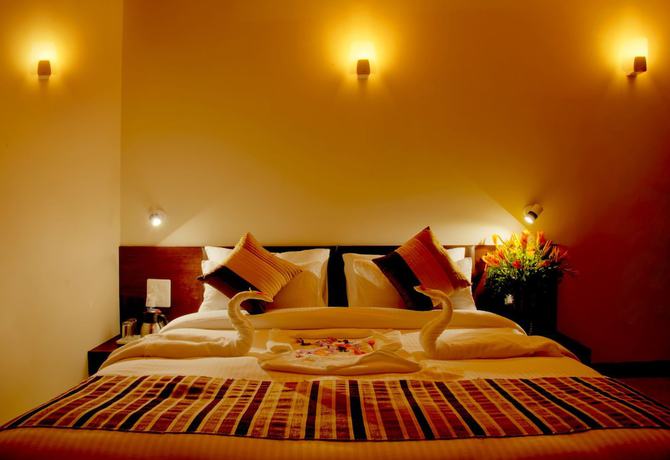 Imagen de la habitación del Hotel The Palm, Mahargaon. Foto 2