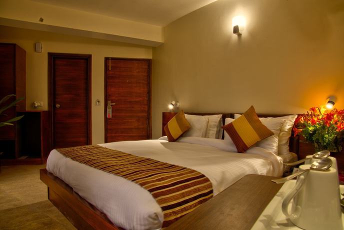 Imagen de la habitación del Hotel The Palm, Mahargaon. Foto 8