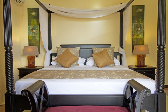 Imagen de la habitación del Hotel The Palm Seychelles. Foto 5