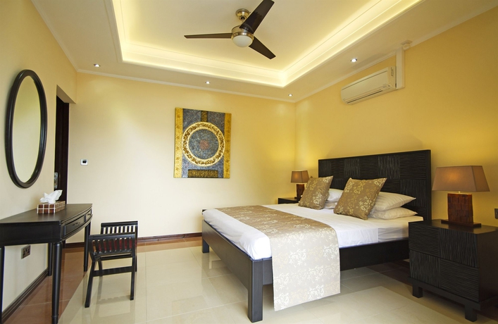 Imagen de la habitación del Hotel The Palm Seychelles. Foto 7