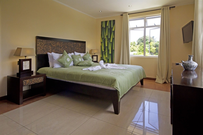 Imagen de la habitación del Hotel The Palm Seychelles. Foto 9