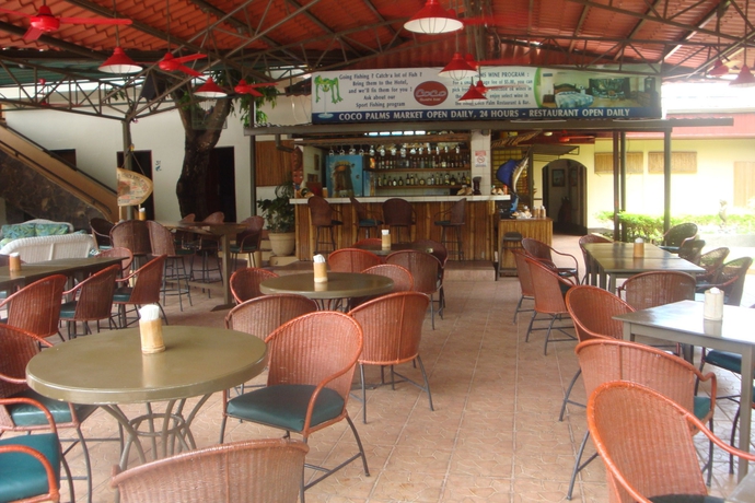 Imagen del bar/restaurante del Hotel The Palms At Coco Beach. Foto 2