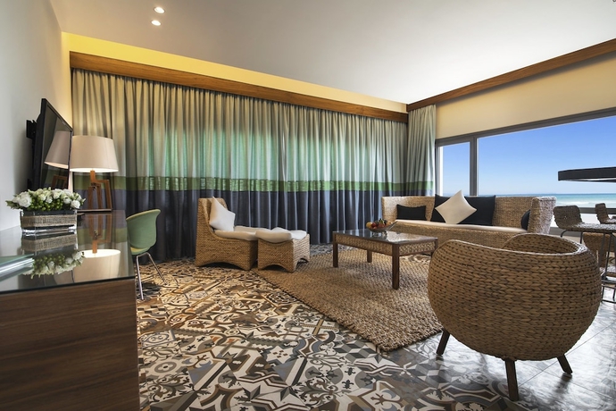 Imagen de la habitación del Hotel The Palms Beach and Spa. Foto 14