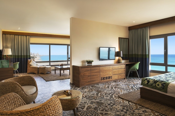 Imagen de la habitación del Hotel The Palms Beach and Spa. Foto 15