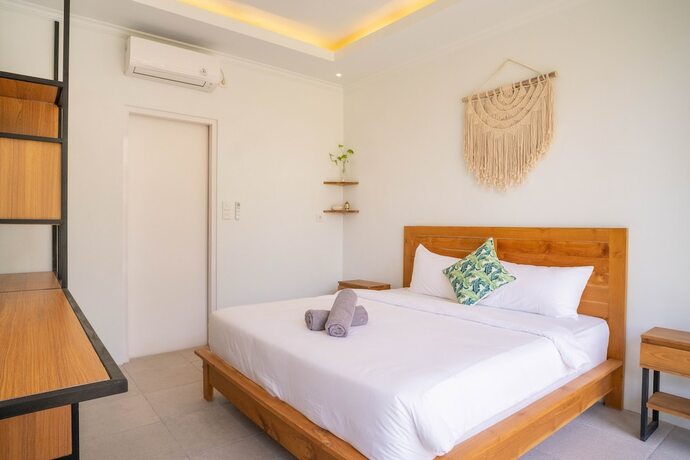 Imagen de la habitación del Hotel The Palms Canggu. Foto 12