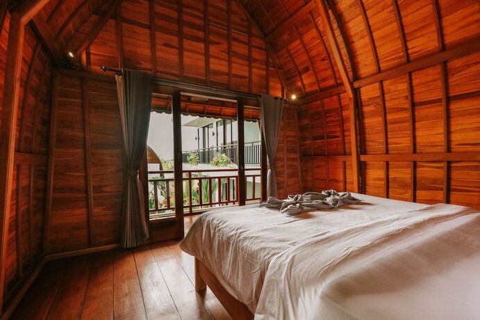 Imagen de la habitación del Hotel The Palms Canggu. Foto 13