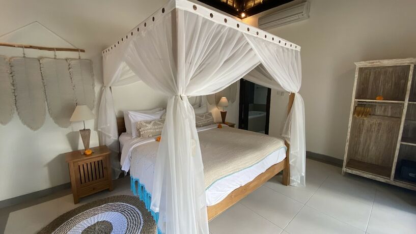 Imagen de la habitación del Hotel The Palms Canggu. Foto 14