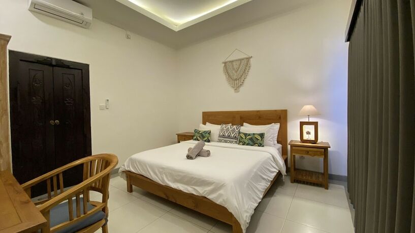 Imagen de la habitación del Hotel The Palms Canggu. Foto 19