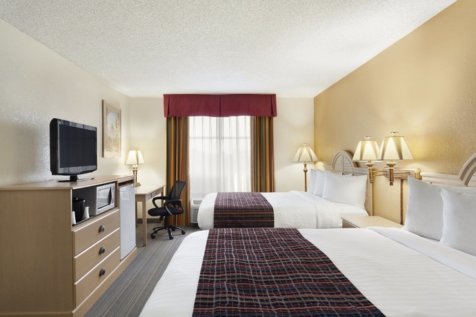 Imagen de la habitación del Hotel The Palms Inn and Suites. Foto 9