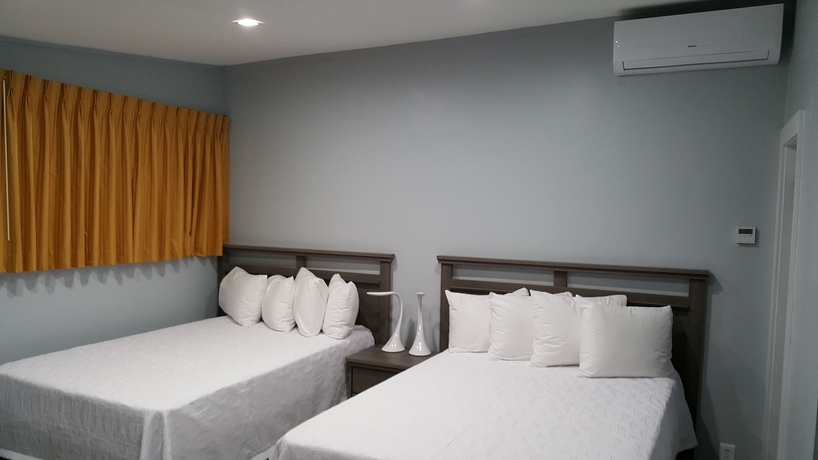 Imagen de la habitación del Hotel The Palms On Ocean. Foto 16