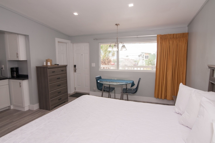 Imagen de la habitación del Hotel The Palms On Ocean. Foto 19