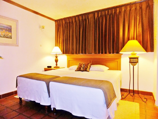 Imagen de la habitación del Hotel The Palms Resort. Foto 8