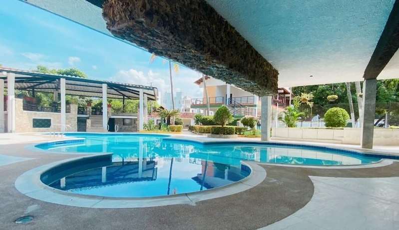 Imagen de la habitación del Hotel The Palms Resort, Melgar. Foto 17