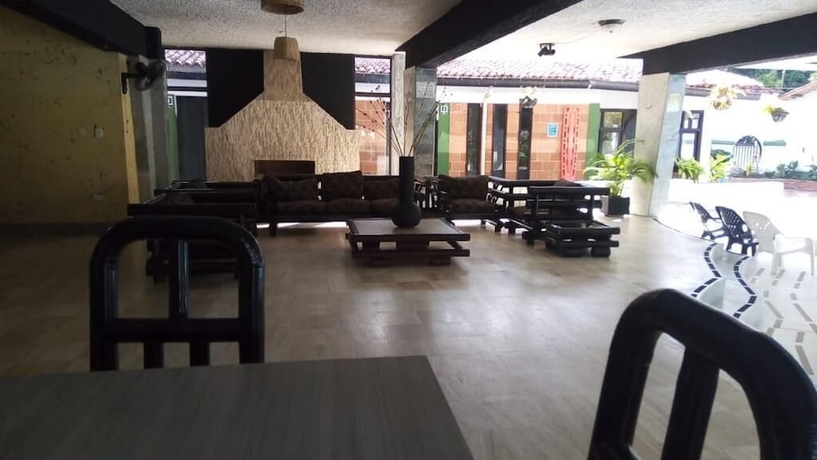 Imagen del bar/restaurante del Hotel The Palms Resort, Melgar. Foto 7