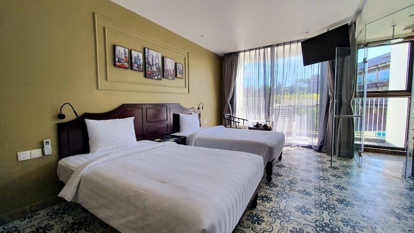 Imagen de la habitación del Hotel The Palmy Luxury Beach Phu Quoc. Foto 8