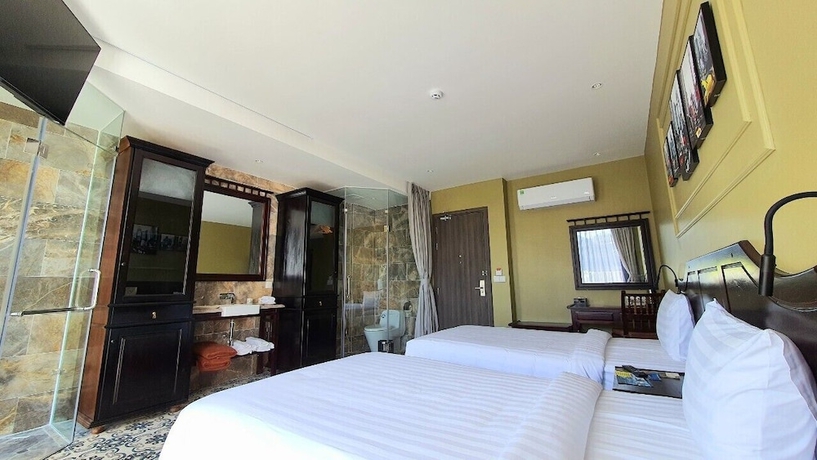 Imagen de la habitación del Hotel The Palmy Luxury Beach Phu Quoc. Foto 11