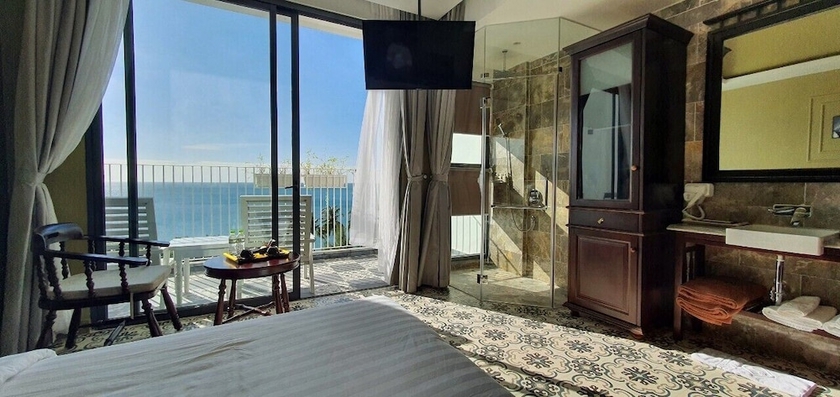 Imagen de la habitación del Hotel The Palmy Luxury Beach Phu Quoc. Foto 14