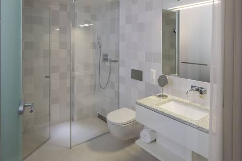 Imagen de la habitación del Hotel The Passage. Foto 16