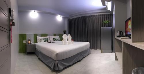 Imagen de la habitación del Hotel The Pat. Foto 6