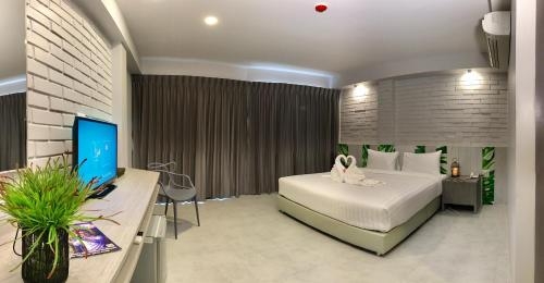 Imagen de la habitación del Hotel The Pat. Foto 8
