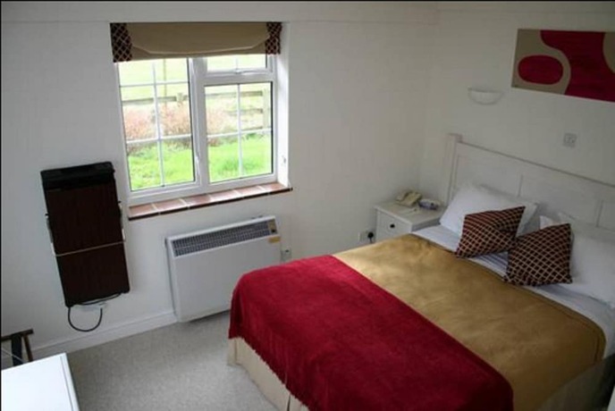 Imagen de la habitación del Hotel The Peacock Country Inn. Foto 11