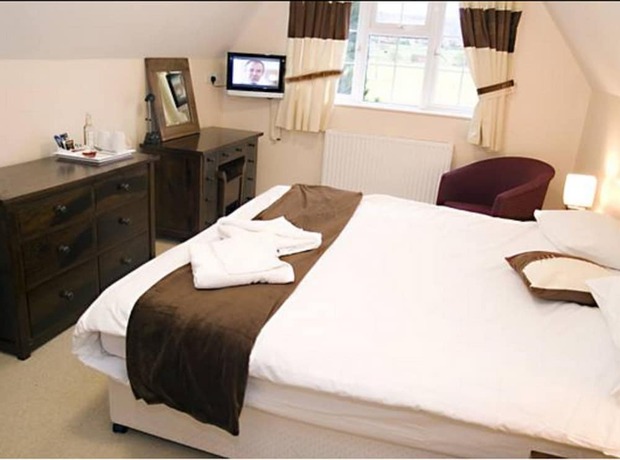 Imagen de la habitación del Hotel The Peacock Country Inn. Foto 17